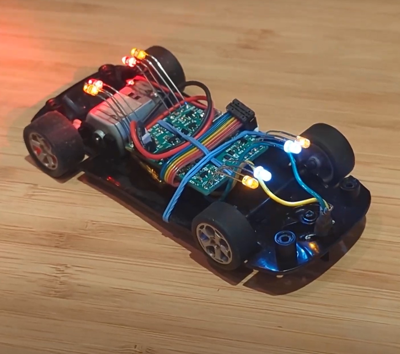 Photo of the LumiRace Prototype 2 in a slot car